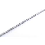 An 18ct white gold and diamond tennis bracelet, with claw set brilliant cut diamonds totalling