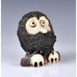 A John Hughes studio pottery Grogg of an owl, 1970s, 6½in. (16.5cm.) high. * Good condition, with no