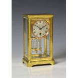 A brass cased four glass mantel clock, late 19th century, possibly American with French single train