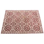 A large part-silk rug by The Rug Company, ref. 25/10198, with claret red snowflake panels on a