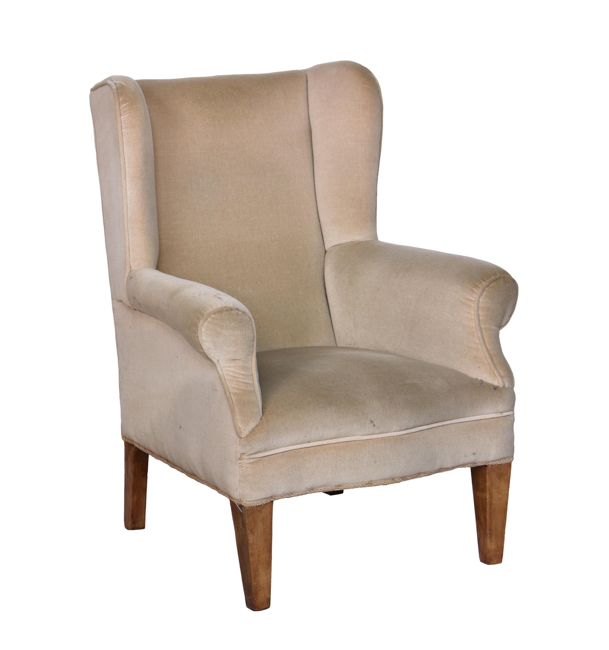 A George III style wingback armchair, early 20th century, with serpentine seat and square tapered