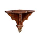 A fine 19th century rosewood and ormolu clock bracket, with break bowfront shelf on three