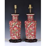 A pair of Chinese porcelain famille rose lamps, 20th century, rouleau form with inverted corners,