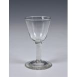 A Georgian air twist wine glass, circa 1750, the ogee bowl on spiral gauze stem, conical foot, 4 ¾