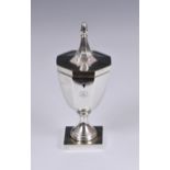 An Edwardian silver octagonal urn / trophy cup form tea caddy, in the style of Adam, George Nathan &