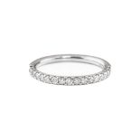 A platinum and diamond half-hoop eternity ring, set with a uniform row of brilliant-cut diamonds,