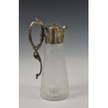 A Victorian etched glass claret jug with silver plate mounts, the clear glass body of conical