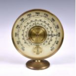 A vintage Jaeger desk weather station, the brass circular rim supporting glass dial with