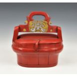 A Chinese wooden red lacquer and gilt picnic basket / box, of panelled wood oval construction,