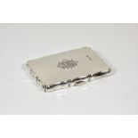 An Edwardian silver aide memoire, Walker & Hall, Chester 1907, shaped rectangular form,