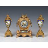 A French gilt metal and porcelain matched three piece clock garniture, early 20th century, in the