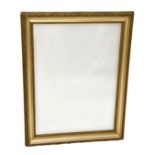 An Edwardian giltwood mirror, with foliate decorated hollow frame, 33½ x 25½in. (85 x 64.75cm.).