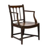 A George III provincial oak and mahogany elbow chair, the three bar back with reeded uprights and