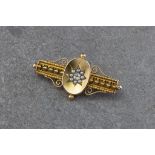 A Victorian 15ct gold, seed pearl and old mine cut diamond brooch in the Etruscan Revival style,