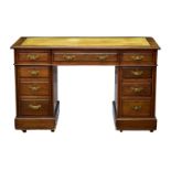 An Edwardian mahogany double pedestal desk, the moulded top with gilt tooled inset leather, over