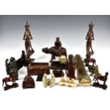 A box of carved wood and bone Oriental animals and figures, to include a small pierced table