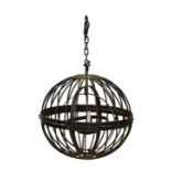 A wrought iron hanging candle lantern, 20th century, the spherical lantern with gimballed two candle