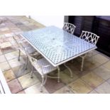 An Oxleys for Harrods of London garden table and chairs, in off-white painted, sand cast