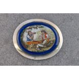 An Italian 19th century micro mosaic plaque, oval, depicting two travellers at rest in a