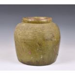 A large antique olive green glazed stoneware jar, with old crack repair, 12in. (30.5cm.) high.