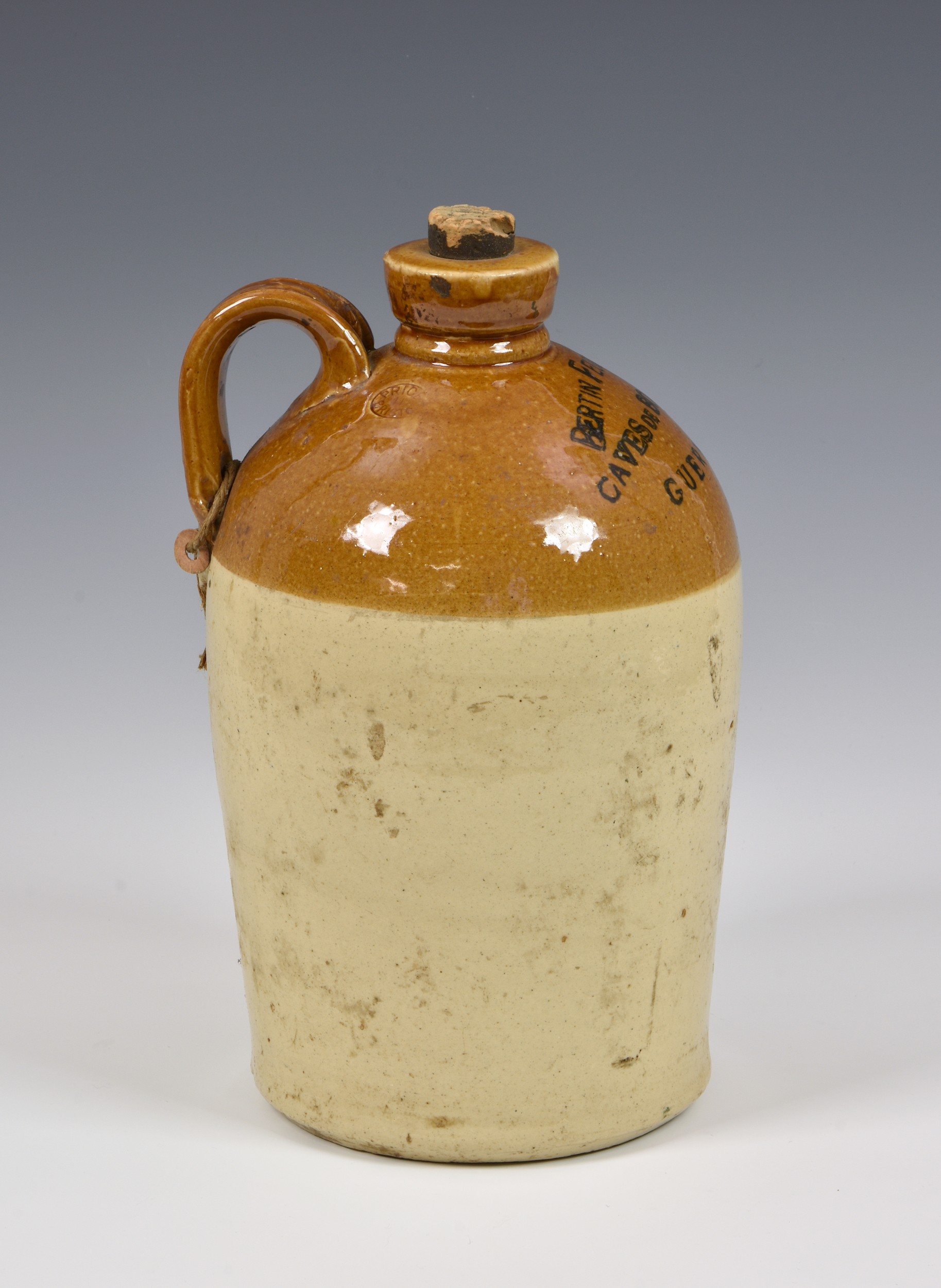 A Guernsey "Bertin Feuillerat" Caves de Bordeaux 2 gallon stoneware flagon, together with another