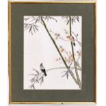 A Chinese embroidery of Birds in bamboo with blossom, 13¼ x 10¼in. (33.6 x 26cm.).