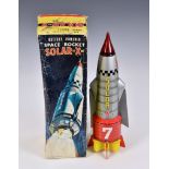 A vintage boxed Japanese battery powered Space Rocket SOLAR-X by Nomura, having blinking lights
