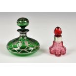 An Art Nouveau green glass silver overlay scent / perfume bottle, of squat globular form, the