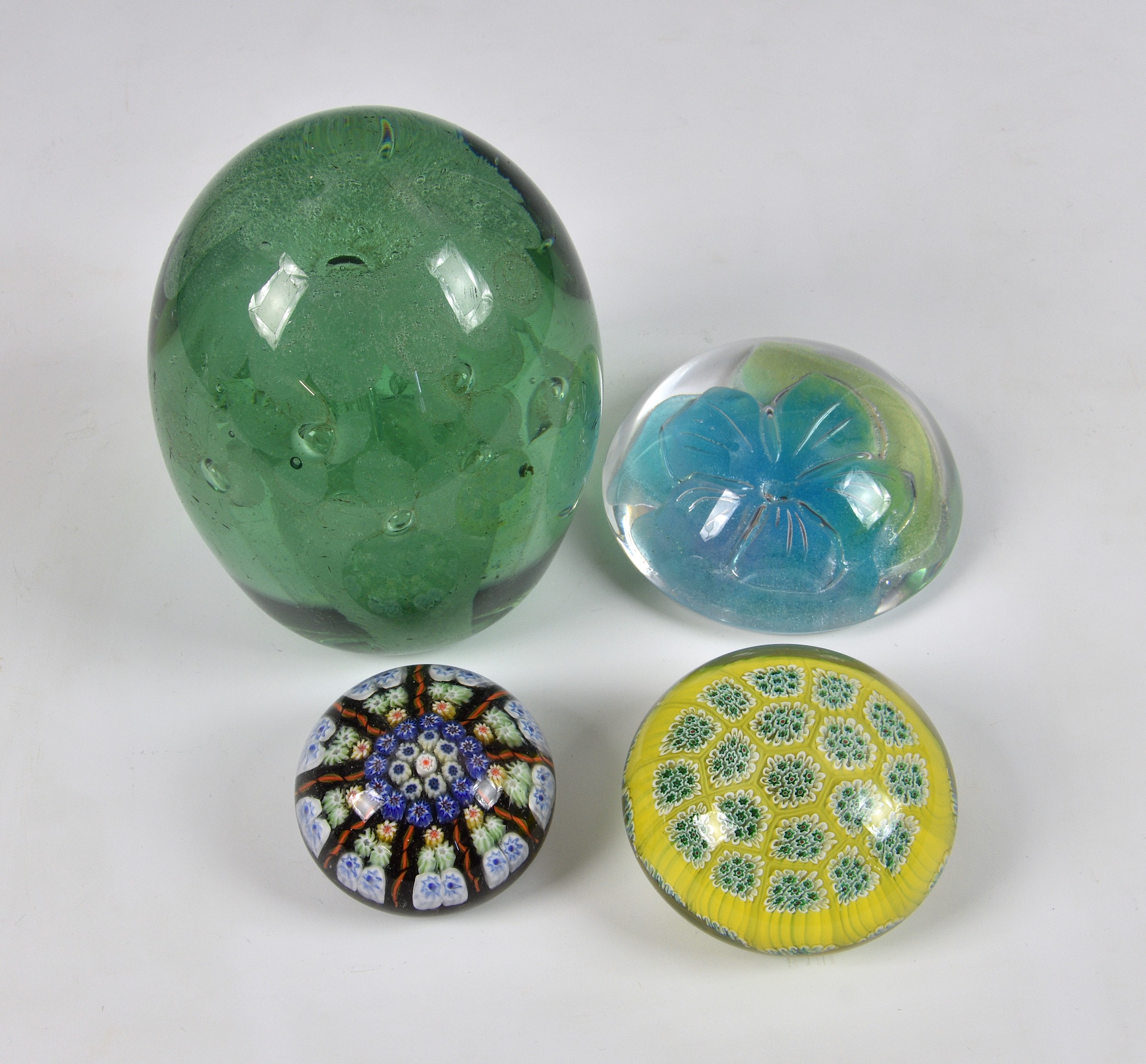 A collection of glass paperweights, to include a Clichy style millefiori paperweight, 2 3/8in. (