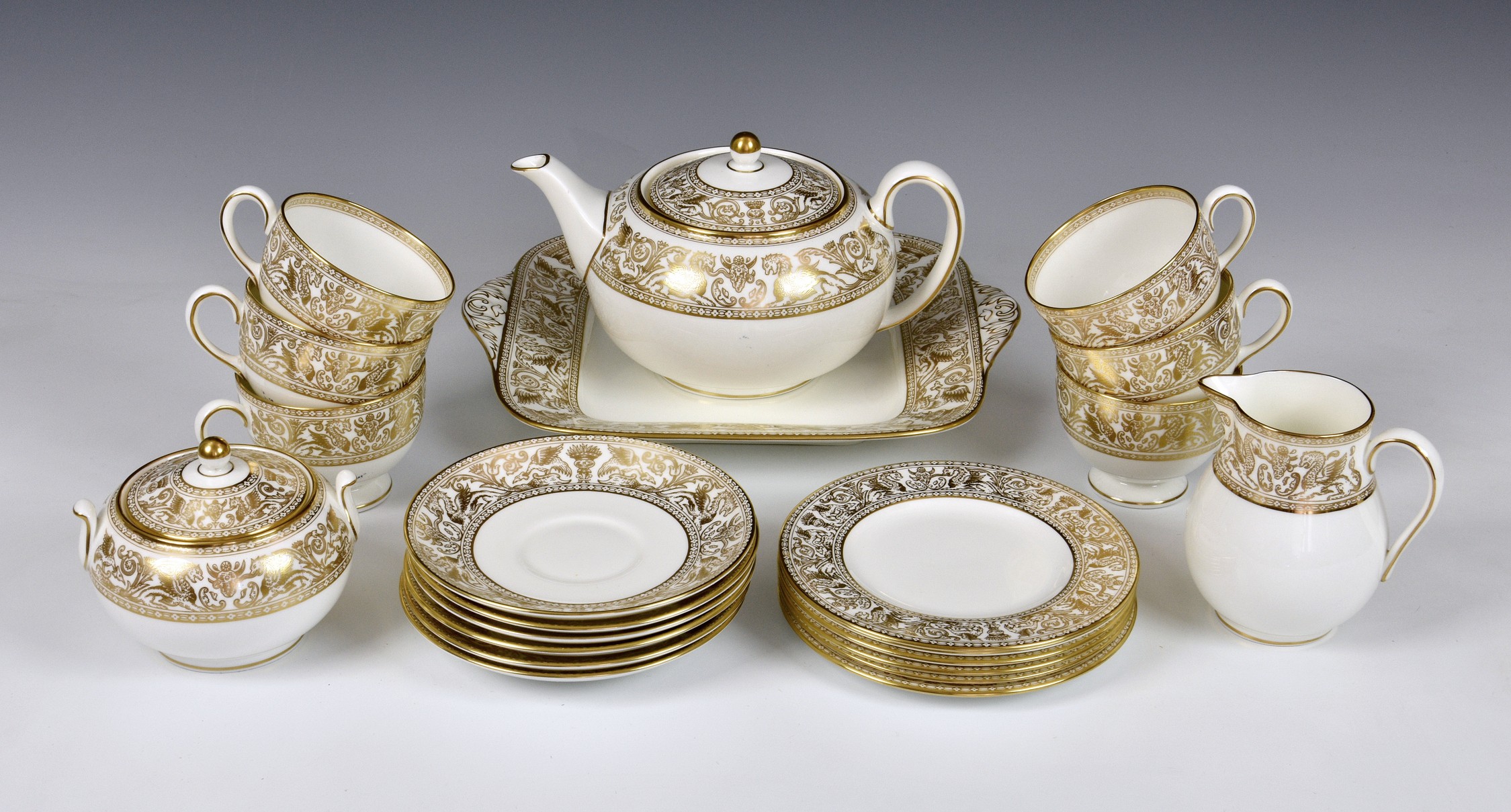A Wedgwood China 'Gold Florentine' pattern tea service, comprising of teapot, six cups & saucers,