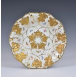 A Meissen gilt leaf moulded dish, mid 20th century, of shaped rounded form, having floral sprays