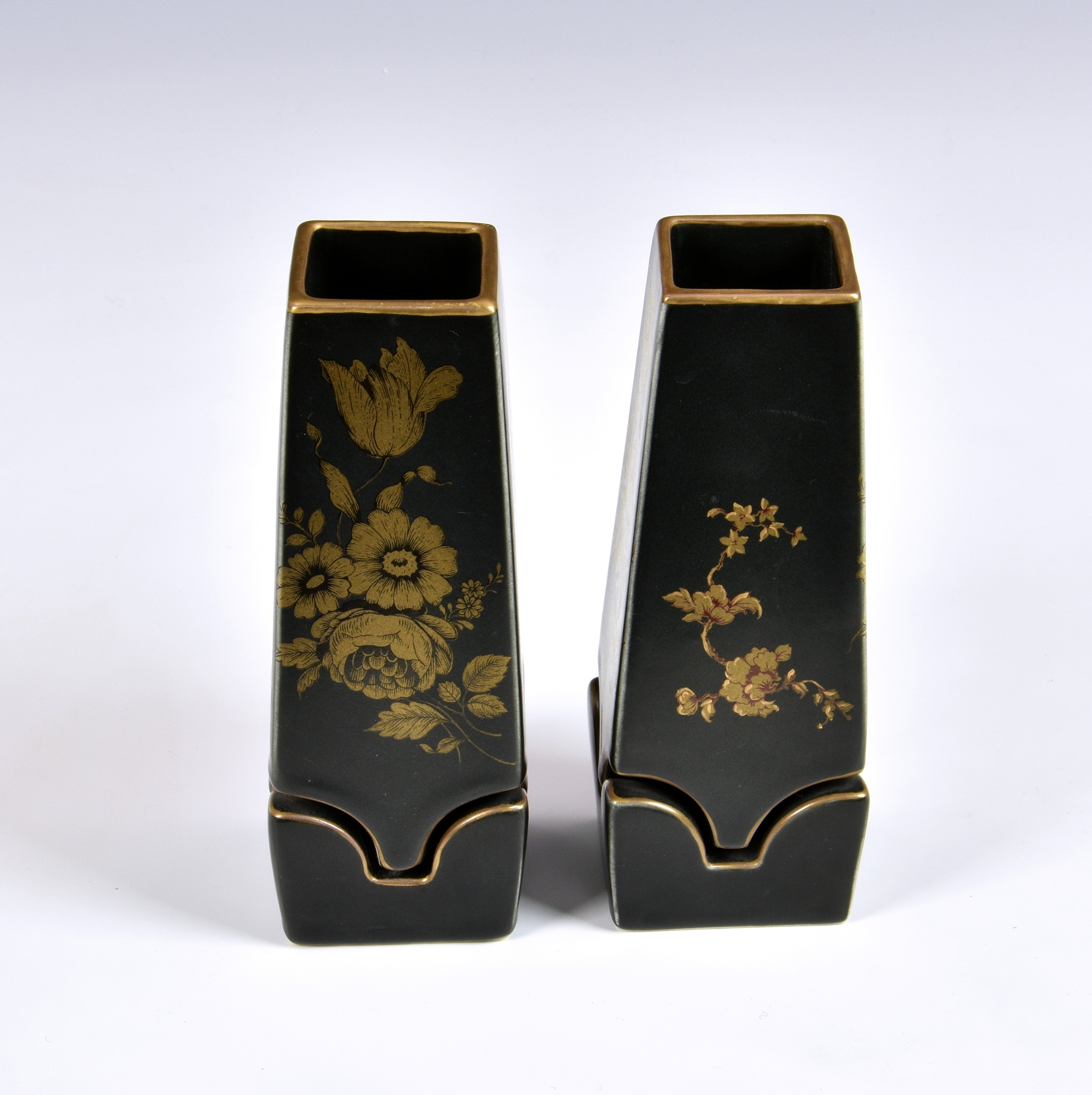A pair of unusual Japanese vases, of tapering square form with shaped cut-out section to base