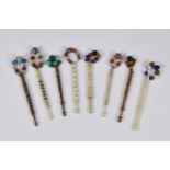 A small collection of eight (8) turned bone & wood lace maker's bobbins, in varying styles with