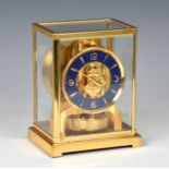 A Jaeger LeCoultre gilt brass Atmos clock, 1980s-90s, with 4¼in. faux-lapis lazuli chapter ring with