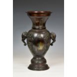 A Chinese patinated bronze two handled vase, probably 19th century, deep red brown patination,