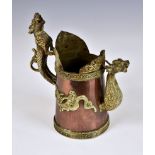 A 20th century copper and brass Tibetan / Chinese dragon jug, the handle and spout fashioned as