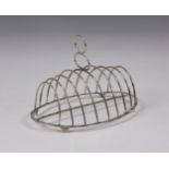 A George III silver toast rack, John Lambe, London, 1786, of oval form, nine plain wire-work bars,