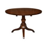 A reproduction mahogany and yew circular tripod coffee table, the burr yew veneered top on a