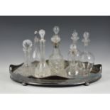 A collection of eight various glass decanters, to include a cut glass version of bell form with