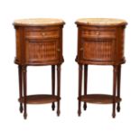 A pair of French oval mahogany, parquetry and marble bedside cabinets, c.1900, the inset ochre and