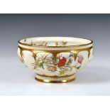 A Royal Worcester pedestal bowl, c. 1890, of fluted circular form, decorated with floral sprays with