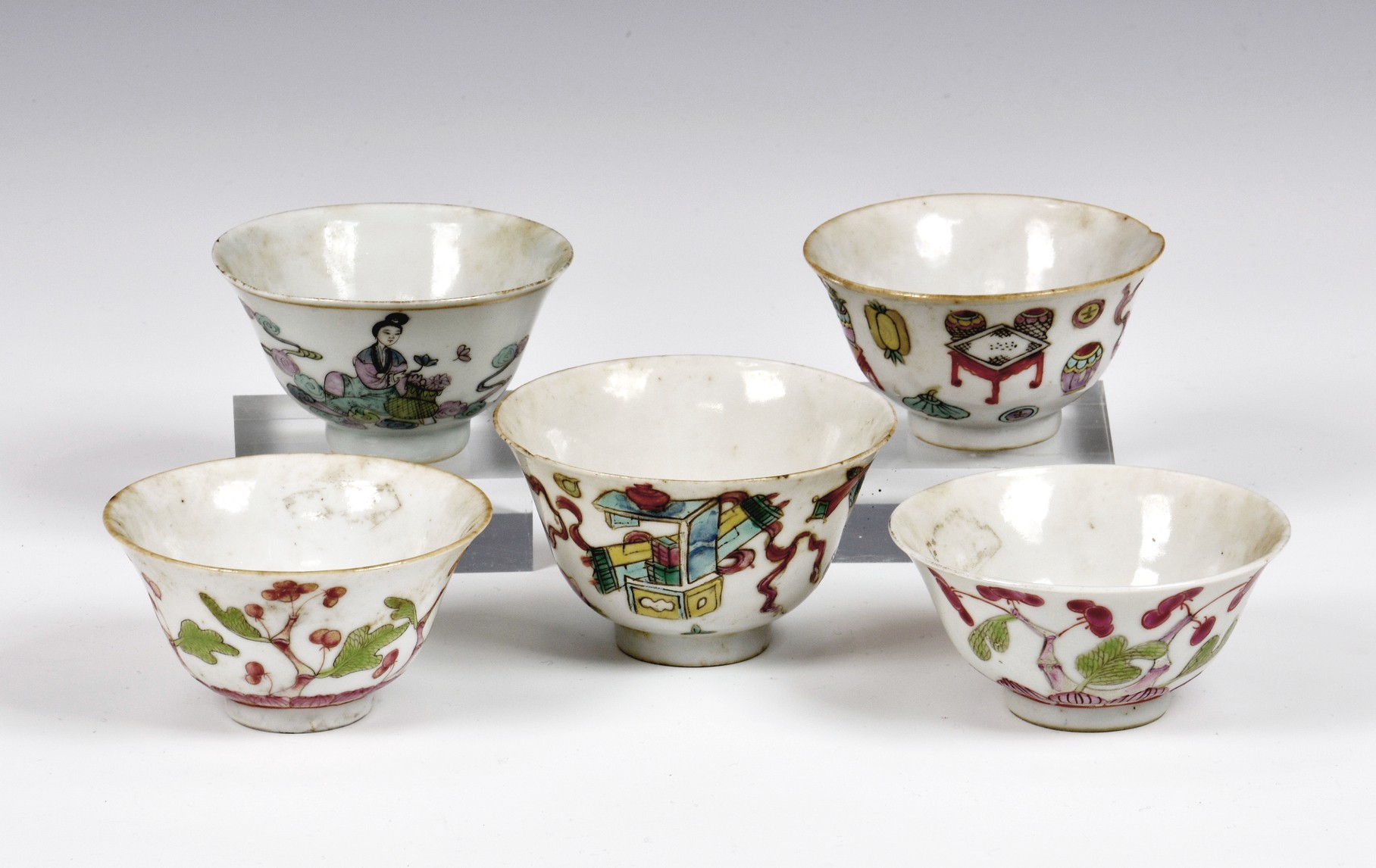 Five Chinese porcelain famille rose bowls, early 20th century, comprising two enamelled with