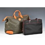 A Brics of London leather trimmed weekend bag, as new condition, in dark grey-green, with tan lather