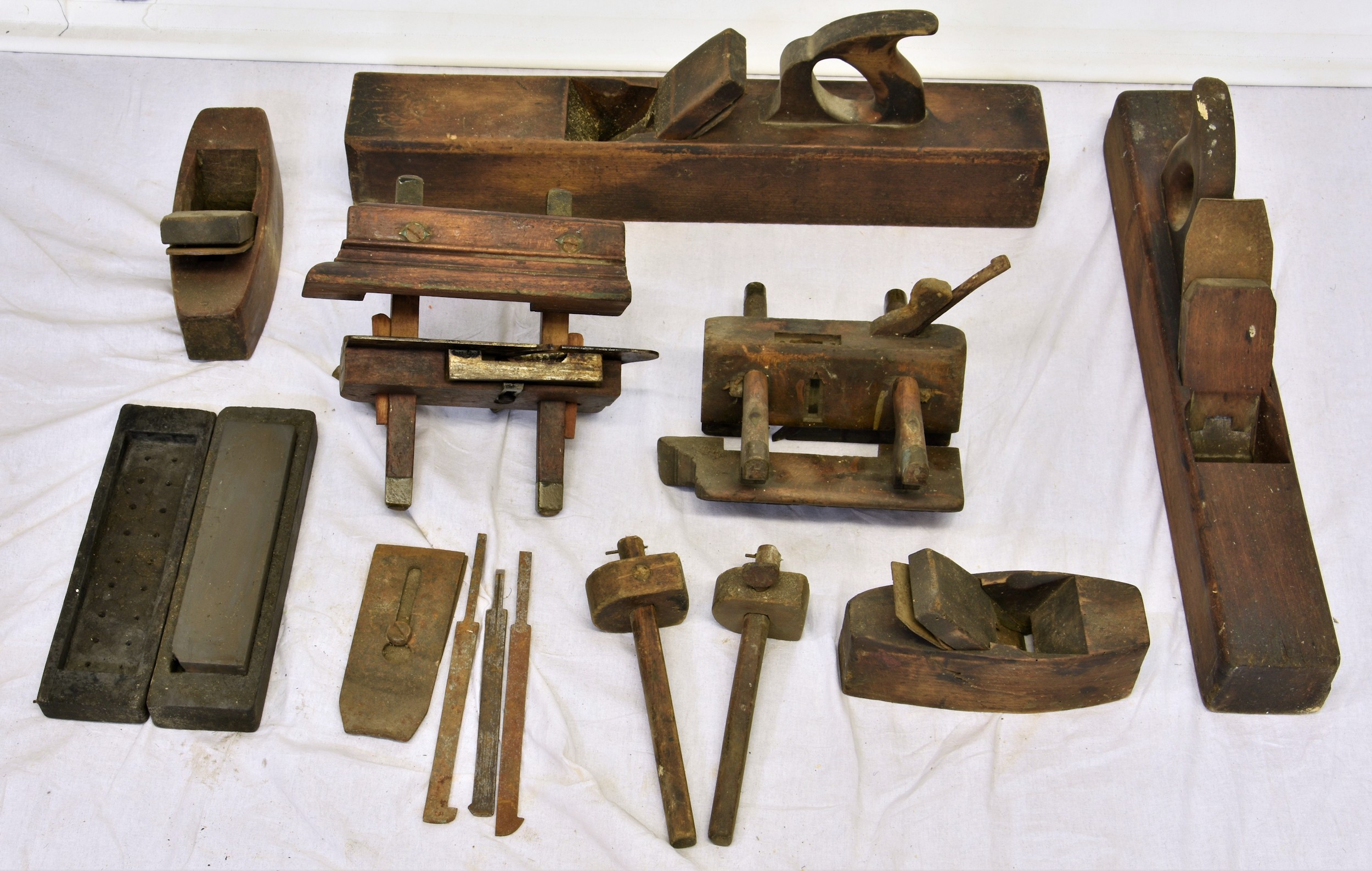 A large collection of various antique woodworking planes, of varying forms, to include jack,