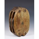 A large 18th century or earlier wooden twin pulley block, of typical elm construction with twin