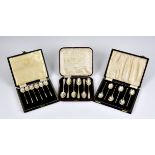 Three cased silver spoon sets, to include a set of six unusual demitasse spoons by Willam Suckling