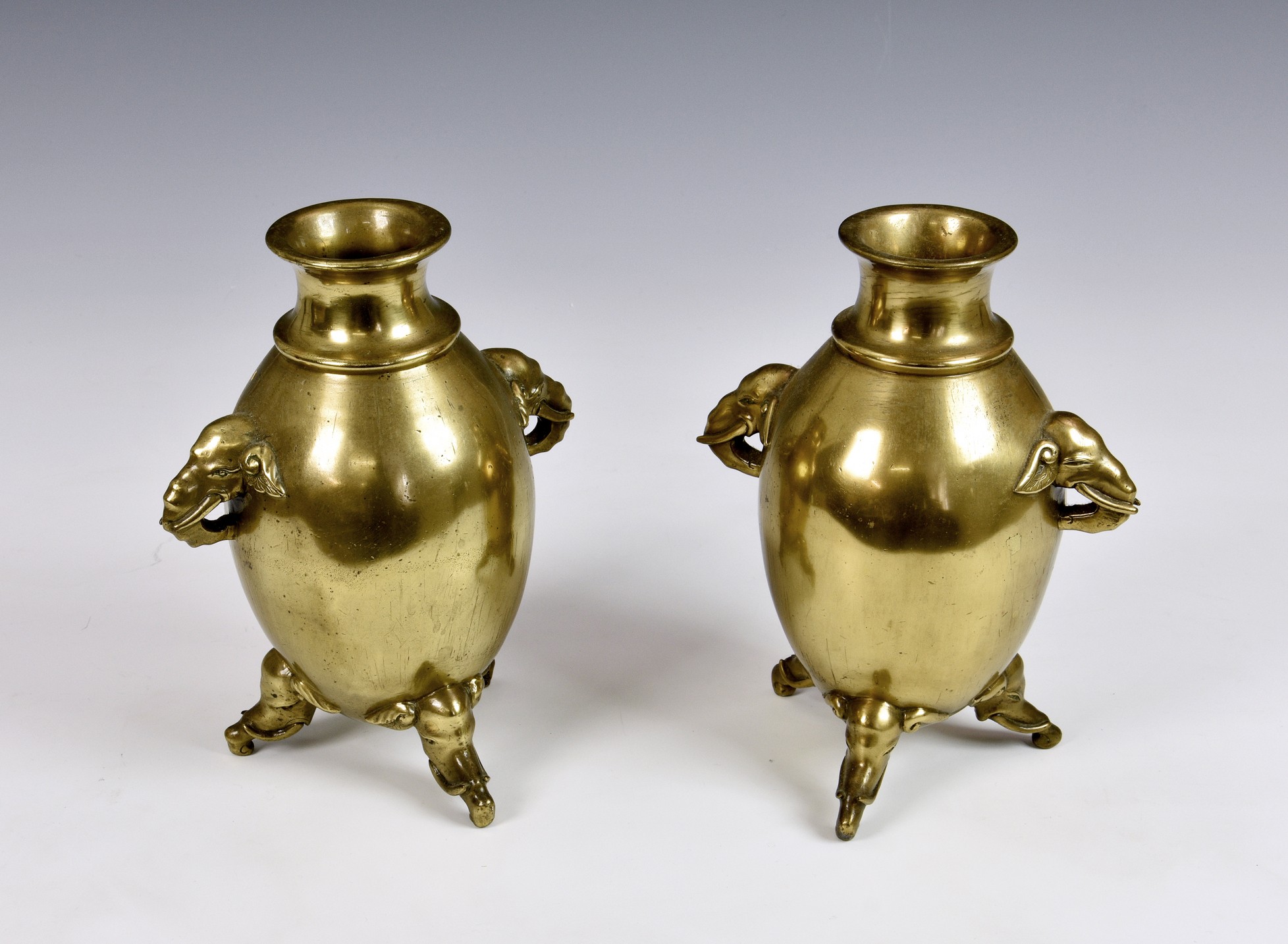 A pair of Chinese bronze 'Elephant' vases, Qing Dynasty, the high globular body with a lipped