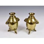 A pair of Chinese bronze 'Elephant' vases, Qing Dynasty, the high globular body with a lipped