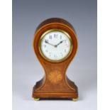 An Edwardian inlaid mahogany mantel clock, the balloon case with boxwood stringing and fan patera,