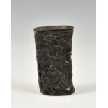 A Chinese faux-horn libation cup, 20th century, incised four character Qianlong mark to base, carved